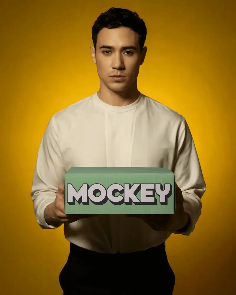 Male Model Showcasing Closed Packaging Box Mockup For Ecommerce Promotions