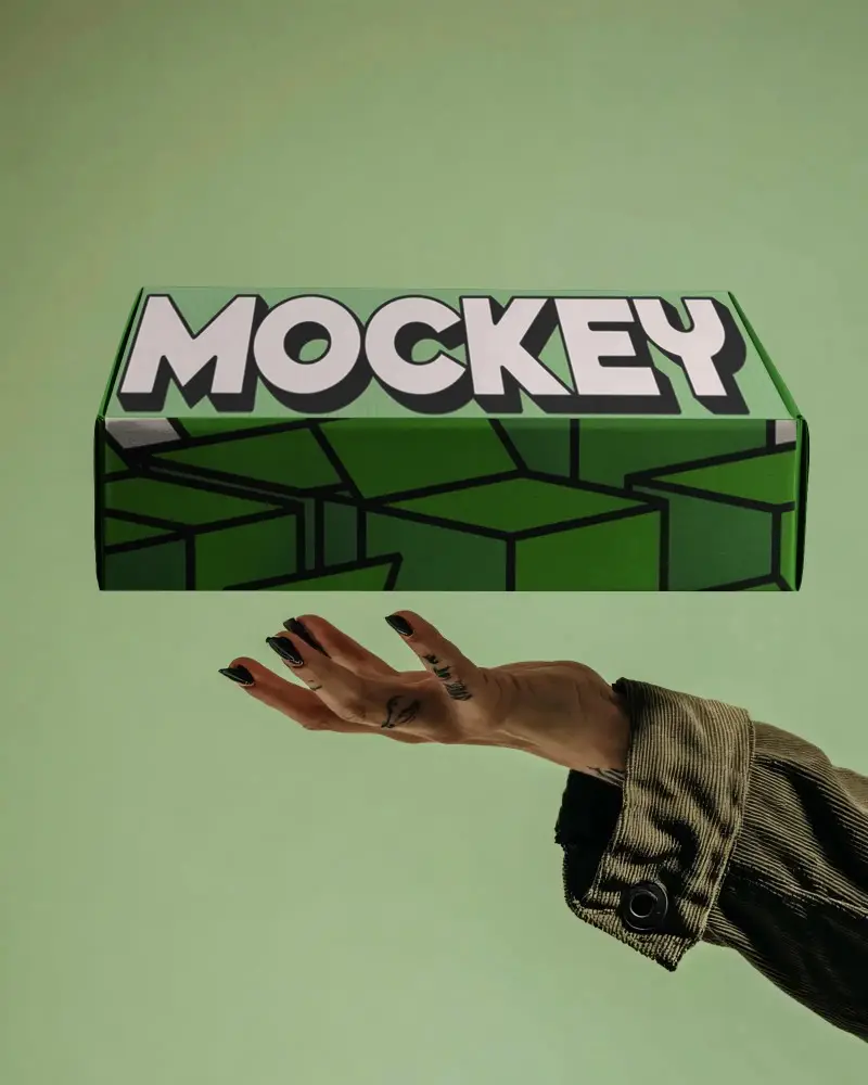 Black Rigid Corrugated Box Mockup Floating Above Hand Minimalist Packaging Display