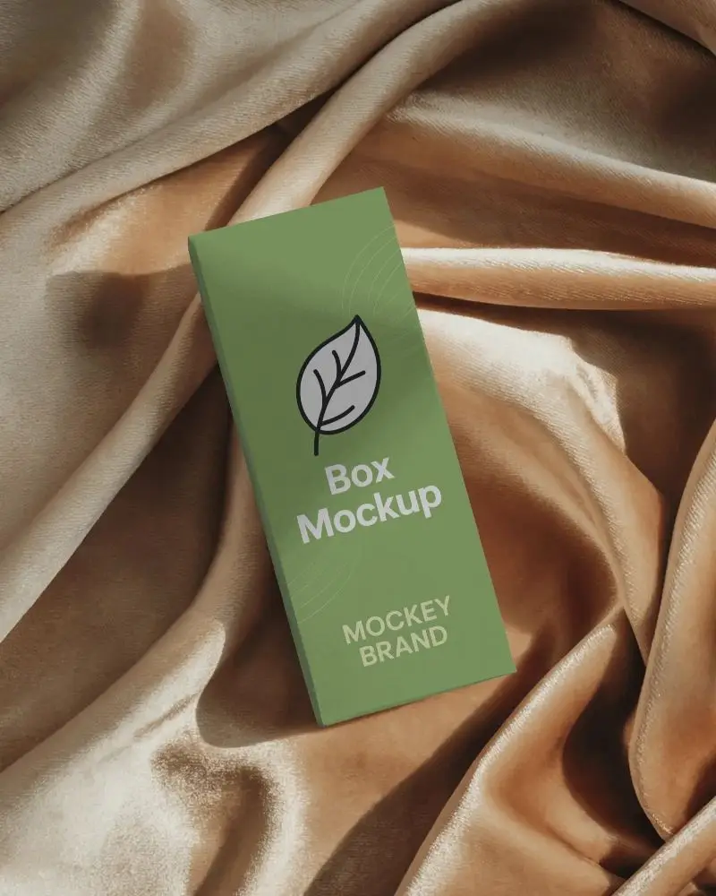 Sleek Rectangular Box Mockup On Luxurious Satin Fabric Top View Shadowed Lighting