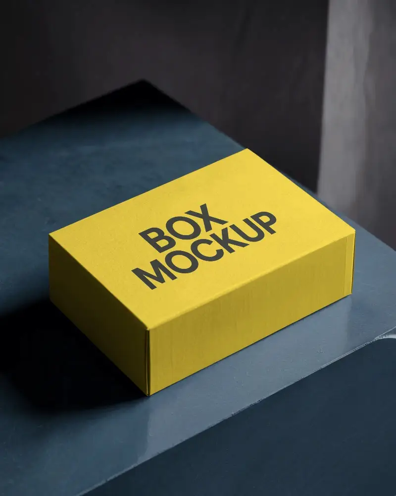 High End Textured Box Mockup On Blue Stone Surface With Matte Lighting And Subtle Contrast