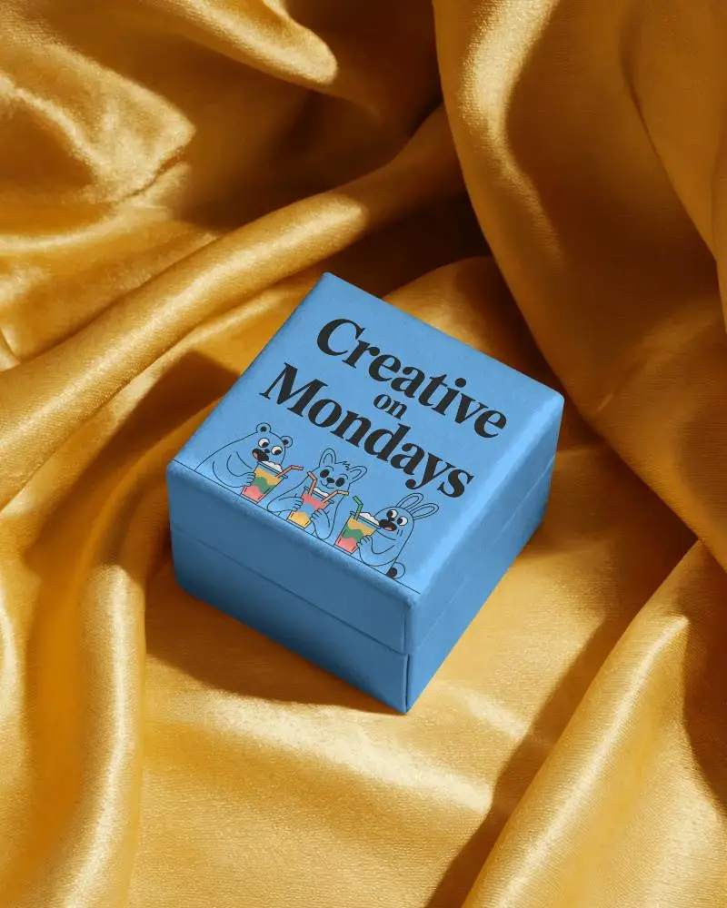 luxury-small-box-mockup-on-yellow-satin-fabric-soft-light-jewelry-display-packaging-scene