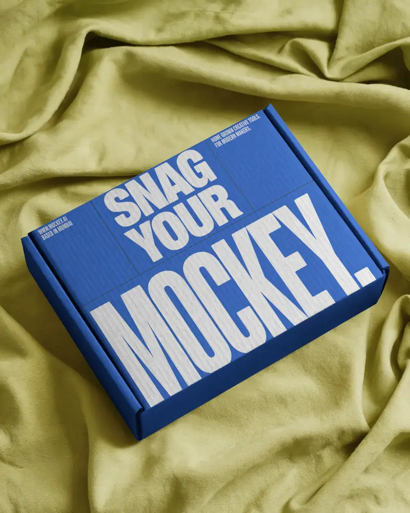 premium-mailer-box-mockup-flat-lay-on-olive-cloth-surface-stylish-luxury-packaging