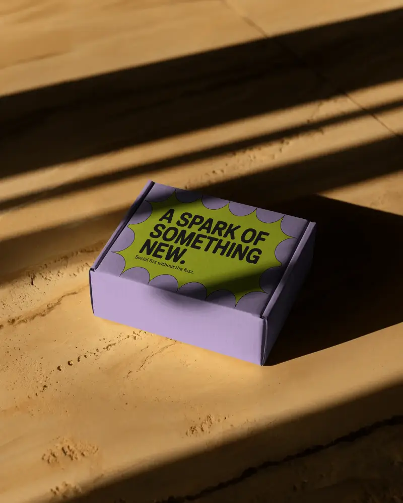 Premium Small Box Mockup On Wooden Surface With Long Sun Shadows In Warm Toned Lighting