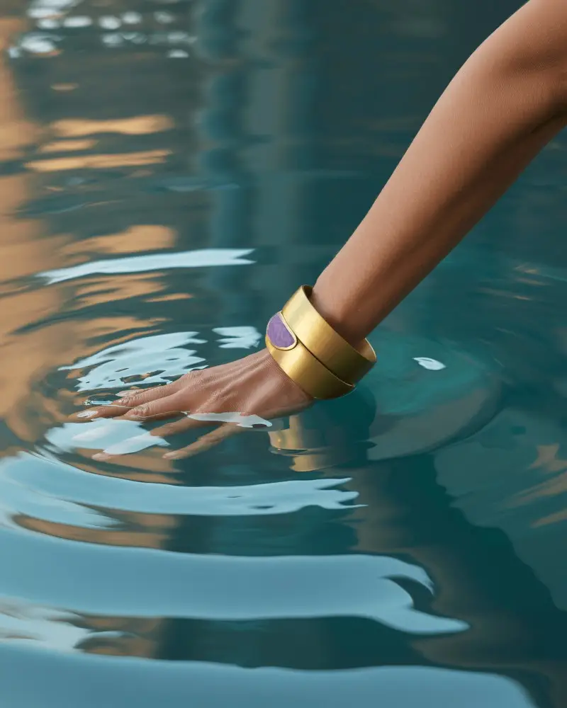 Gold Statement Bracelet Mockup On Hand Gliding Through Water With Luxury Summer Vibe