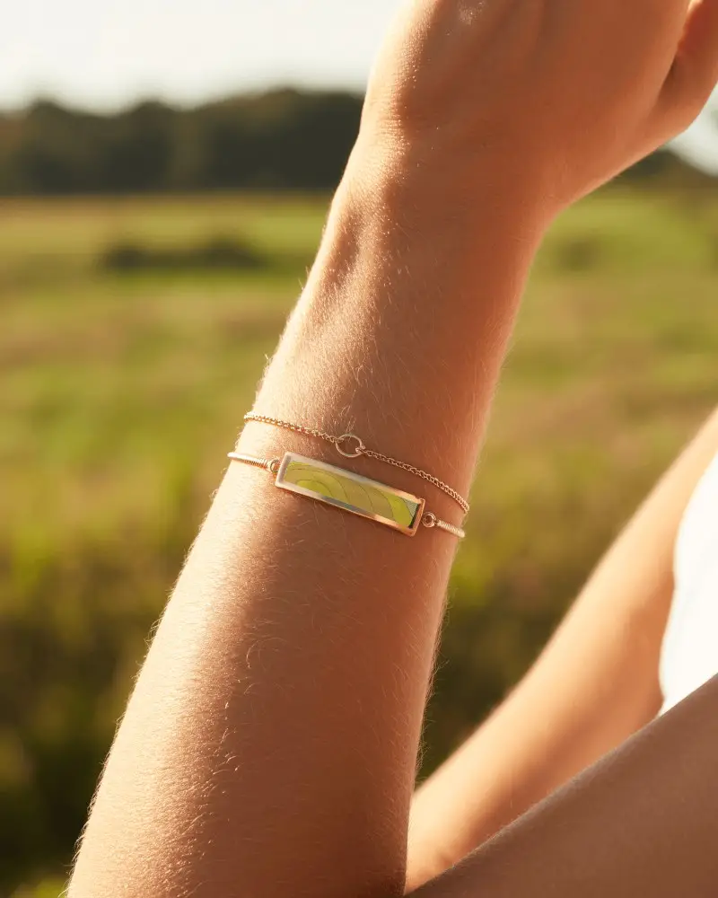 Sunlit Gold Bracelet Mockup On Wrist In Bright Outdoor Field Setting In Warm Natural Sunlight
