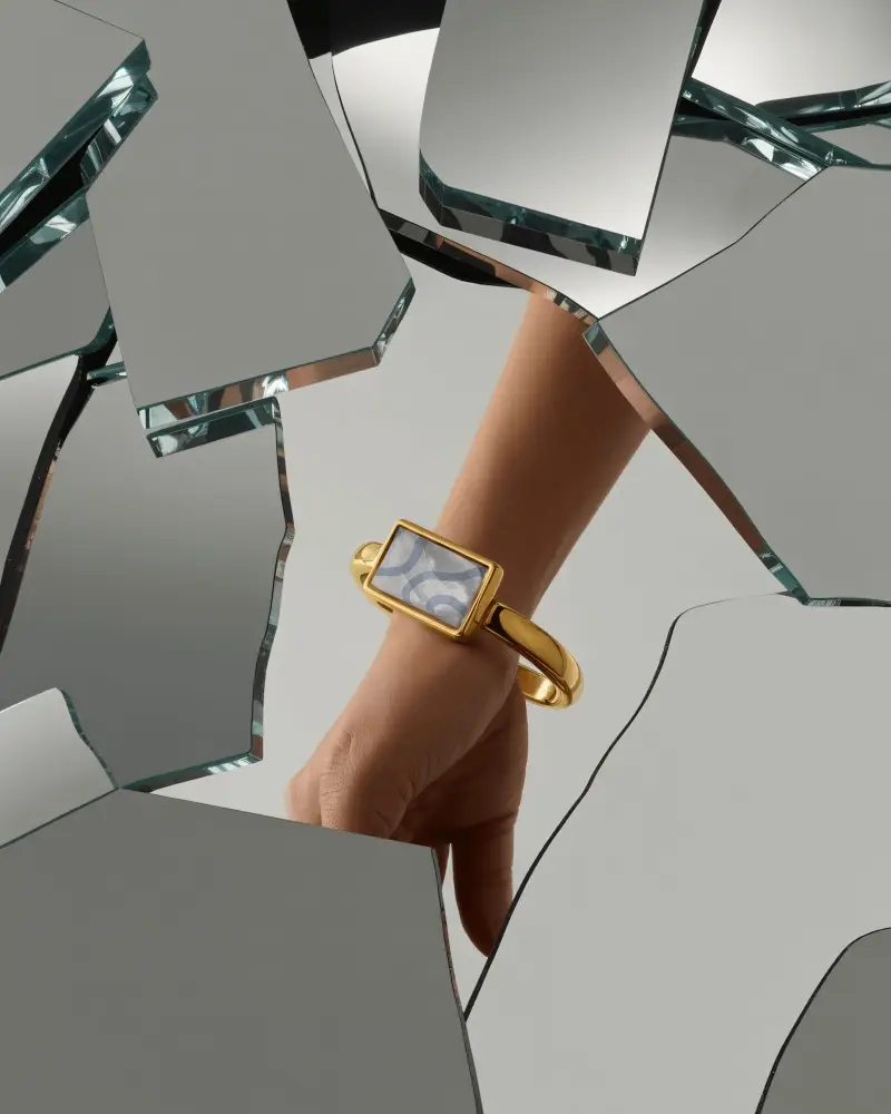 Gold Statement Bracelet Mockup Through Broken Mirror Fragments
