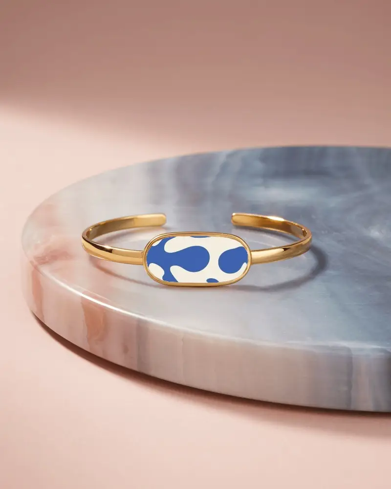 Elegant Gold Cuff Bracelet Mockup With Oval Plate On Marble Display In Soft Pink Lighting