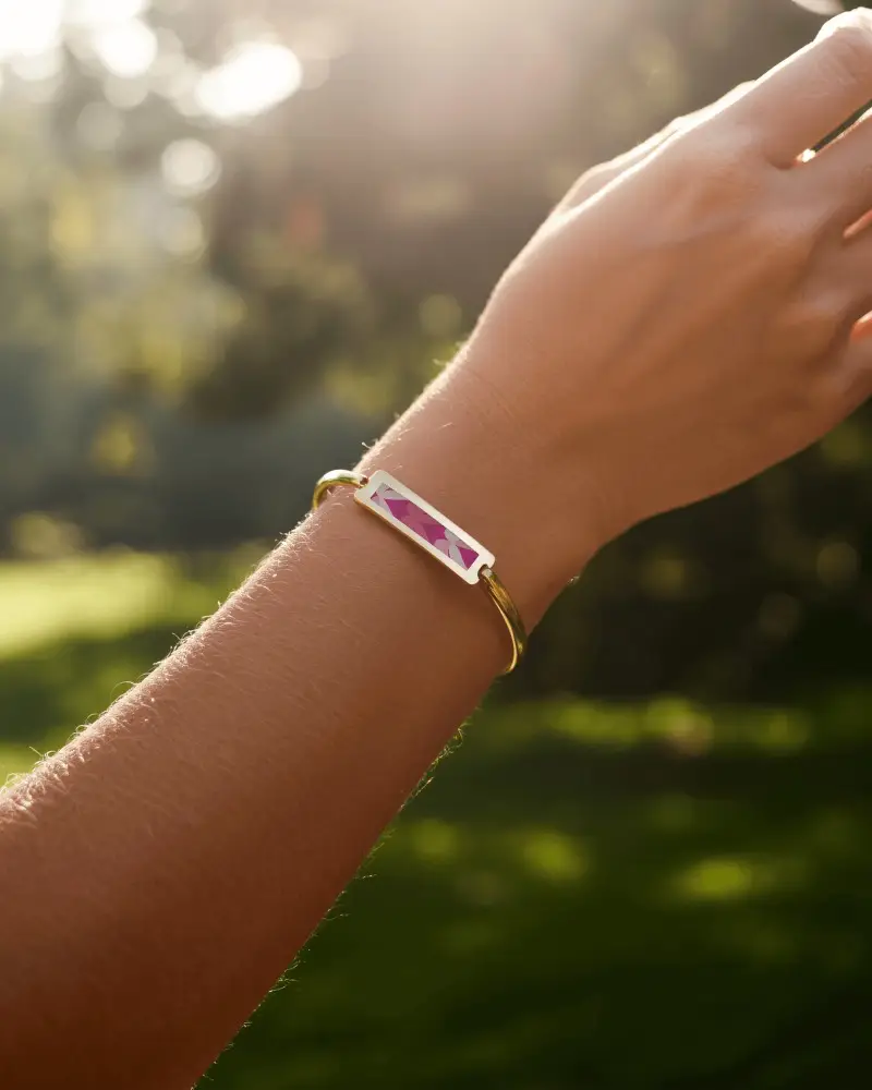 Sunlit Gold Bracelet Mockup On Wrist In Natural Outdoor Light With Soft Green Background