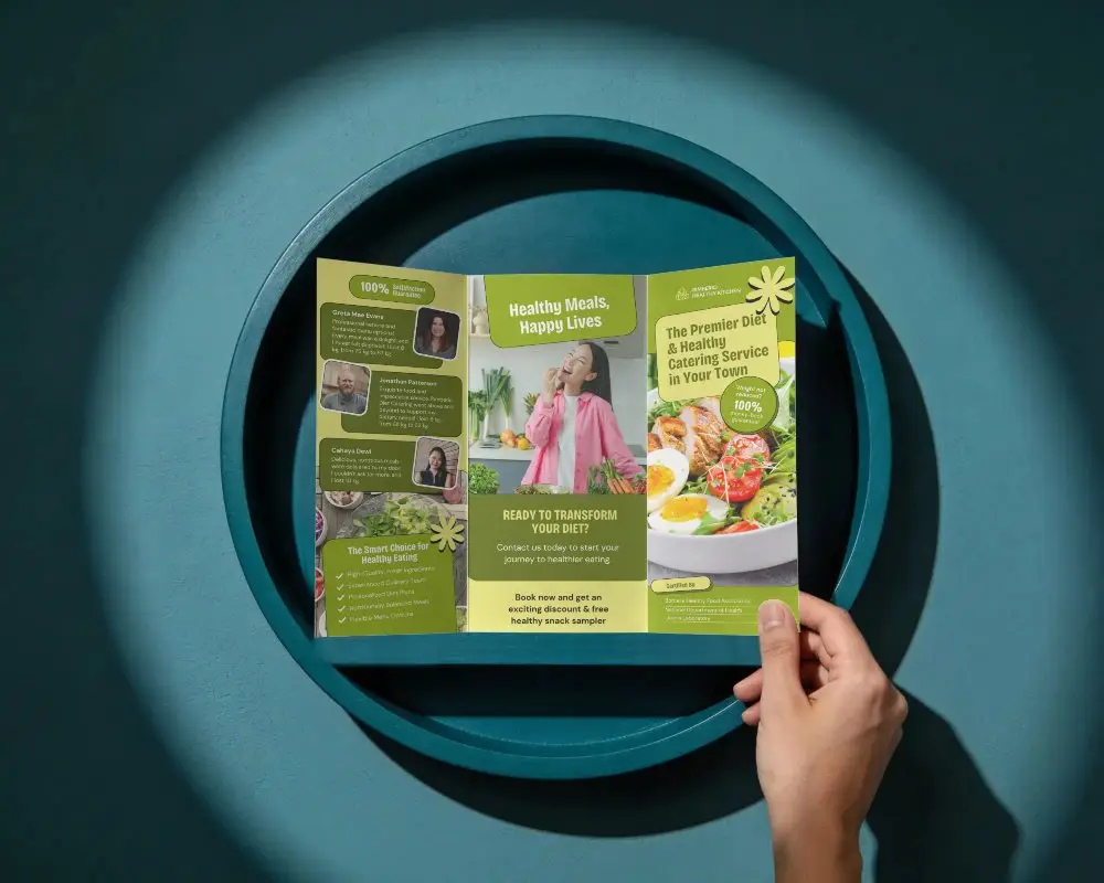 Hand Holding Trifold Brochure Mockup On Abstract Round Platform For Design Presentation