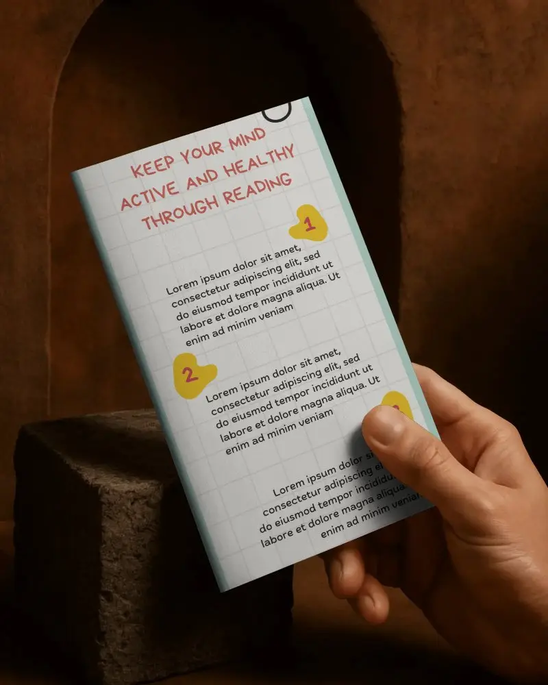 Hand Holding Minimalist Brochure Mockup On Textured Surface For Design Presentation