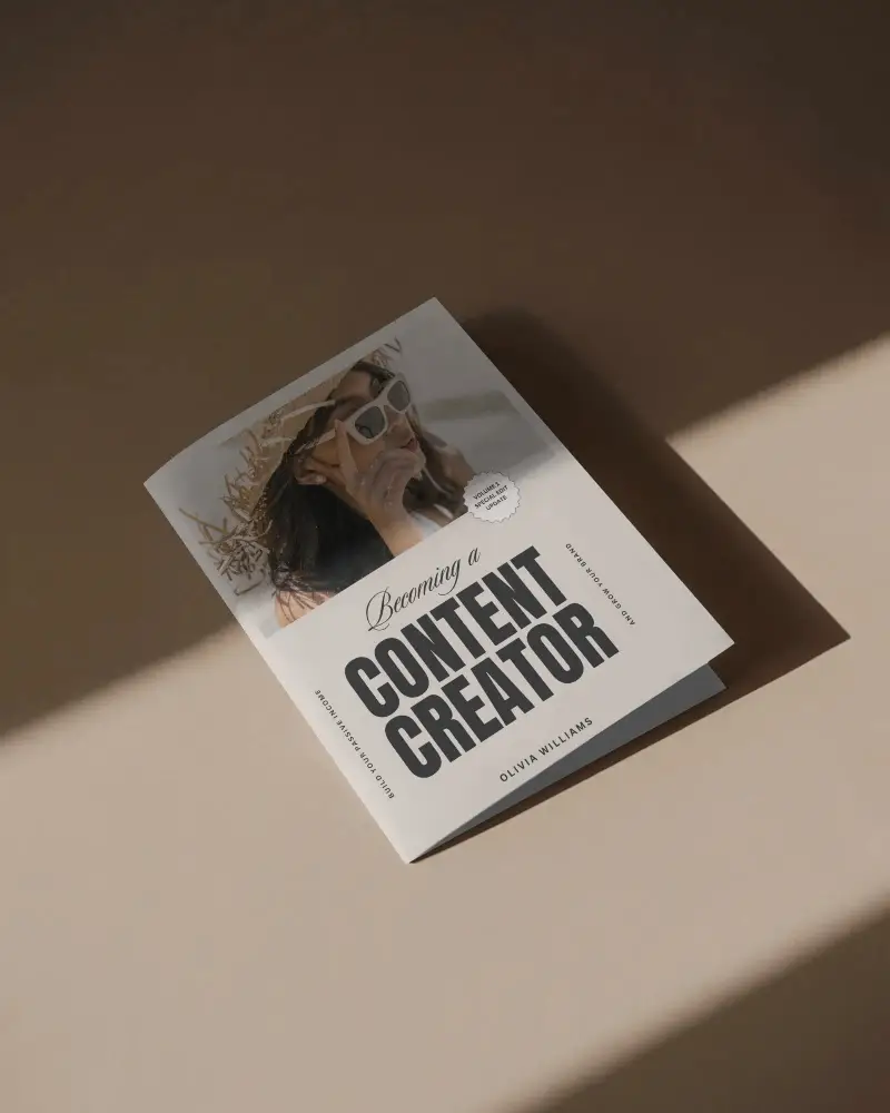 minimal-brochure-mockup-half-fold-placed-on-brown-surface-with-dramatic-light-and-shadow