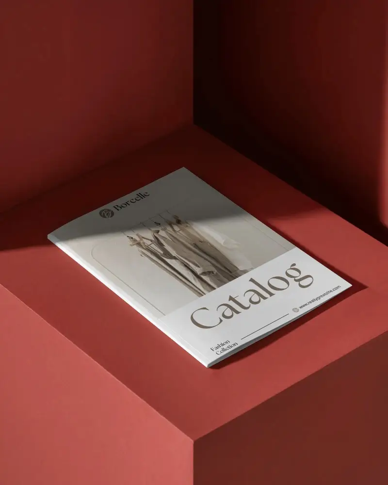 modern-brochure-mockup-on-bold-red-surface-under-sharp-contrasting-shadows