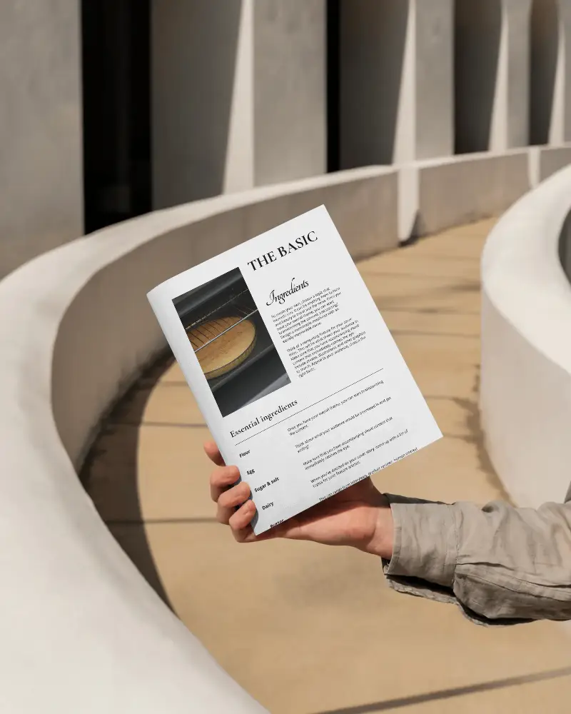 clean-brochure-mockup-presented-by-hand-against-contemporary-architectural-design