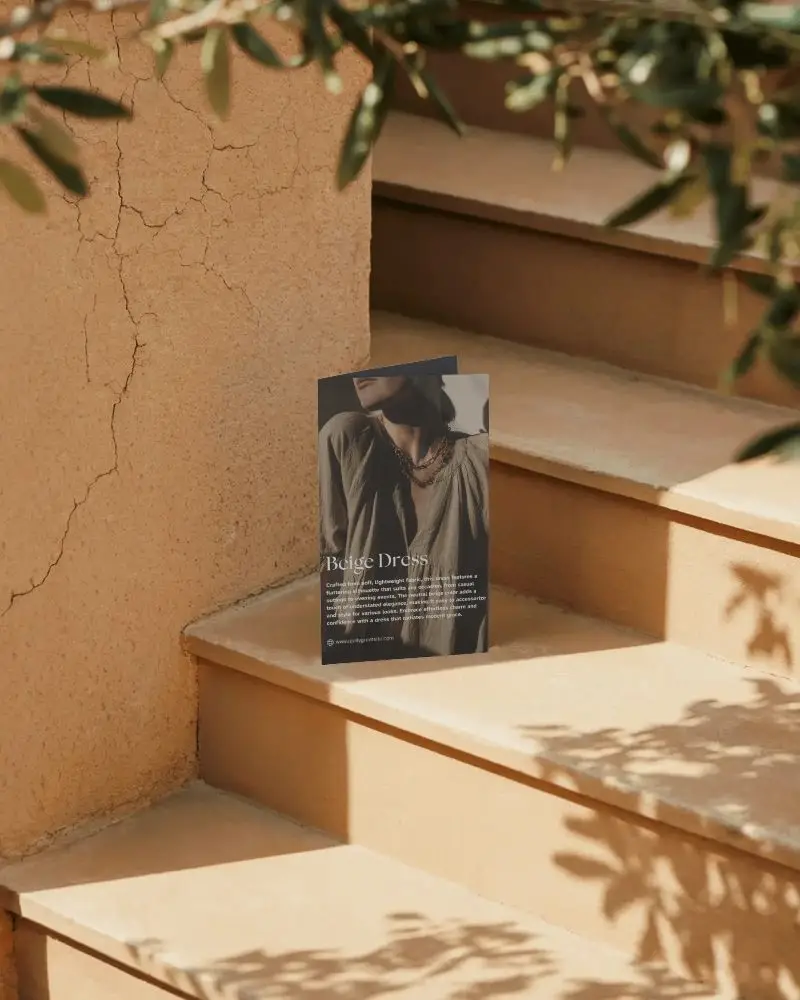 Folded Paper Brochure Standing On Step Outdoor Setting With Soft Shadow Patterns