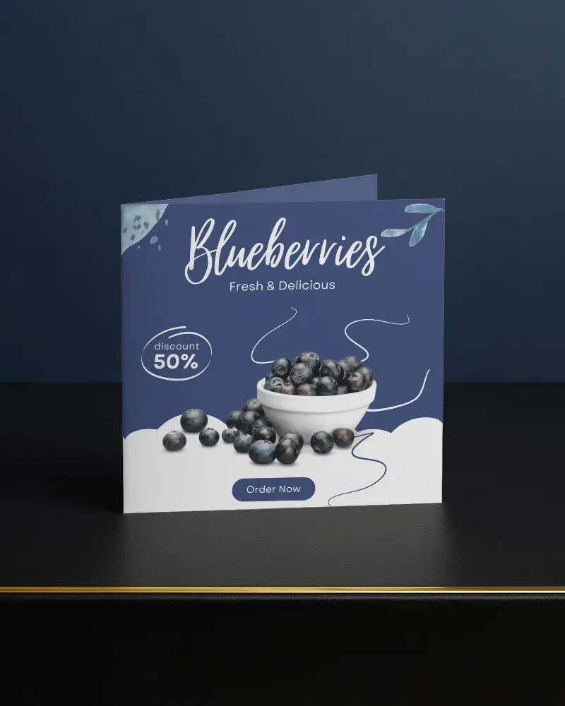 Standing Folded Brochure Mockup On Black Table With Navy Background And Elegant Light