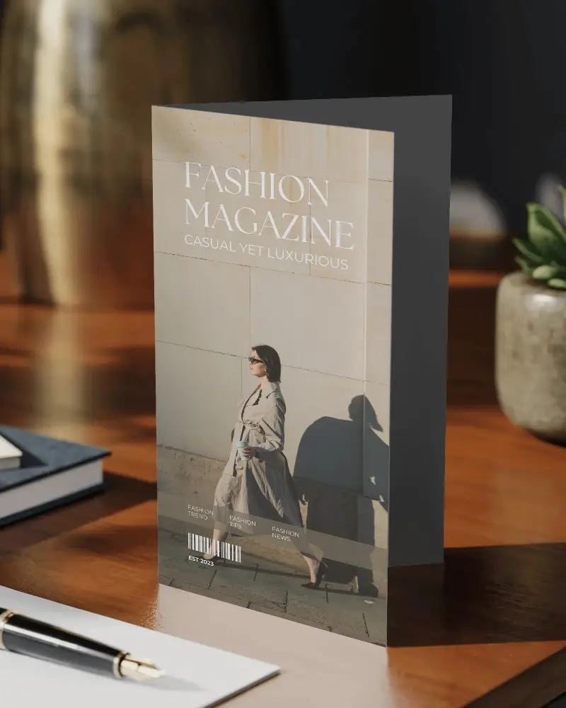 standing-brochure-mockup-on-wooden-table-with-office-accessories-for-presentation