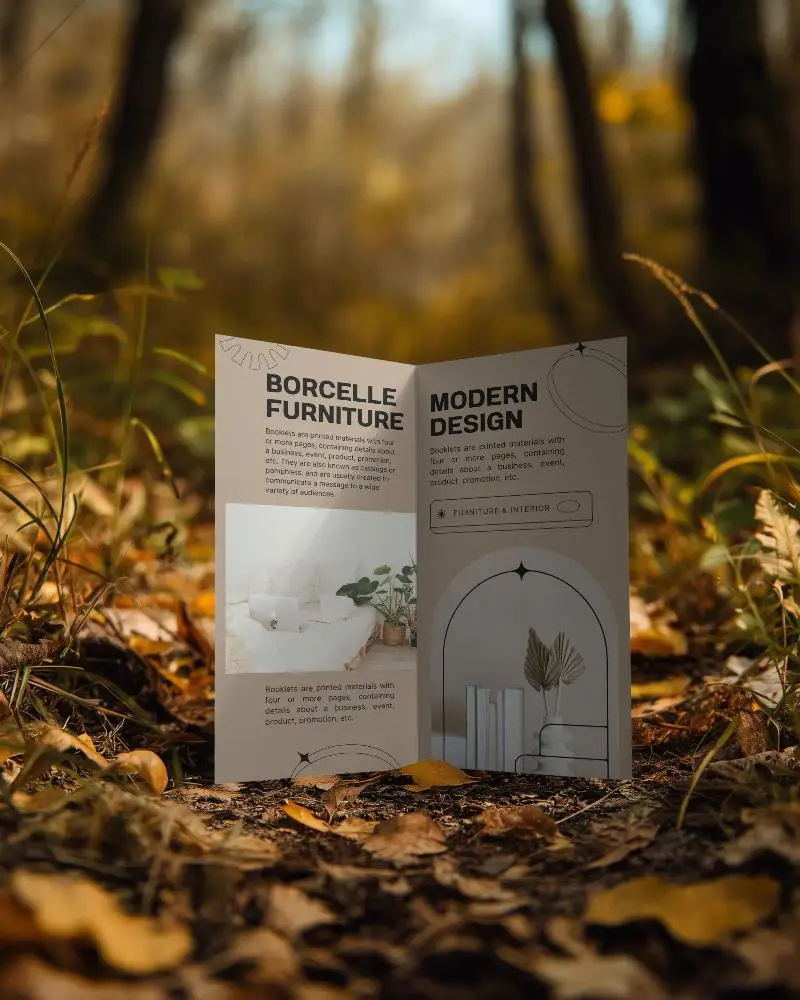 Open Brochure Mockup Standing On Autumn Leaves With Soft Blurred Background