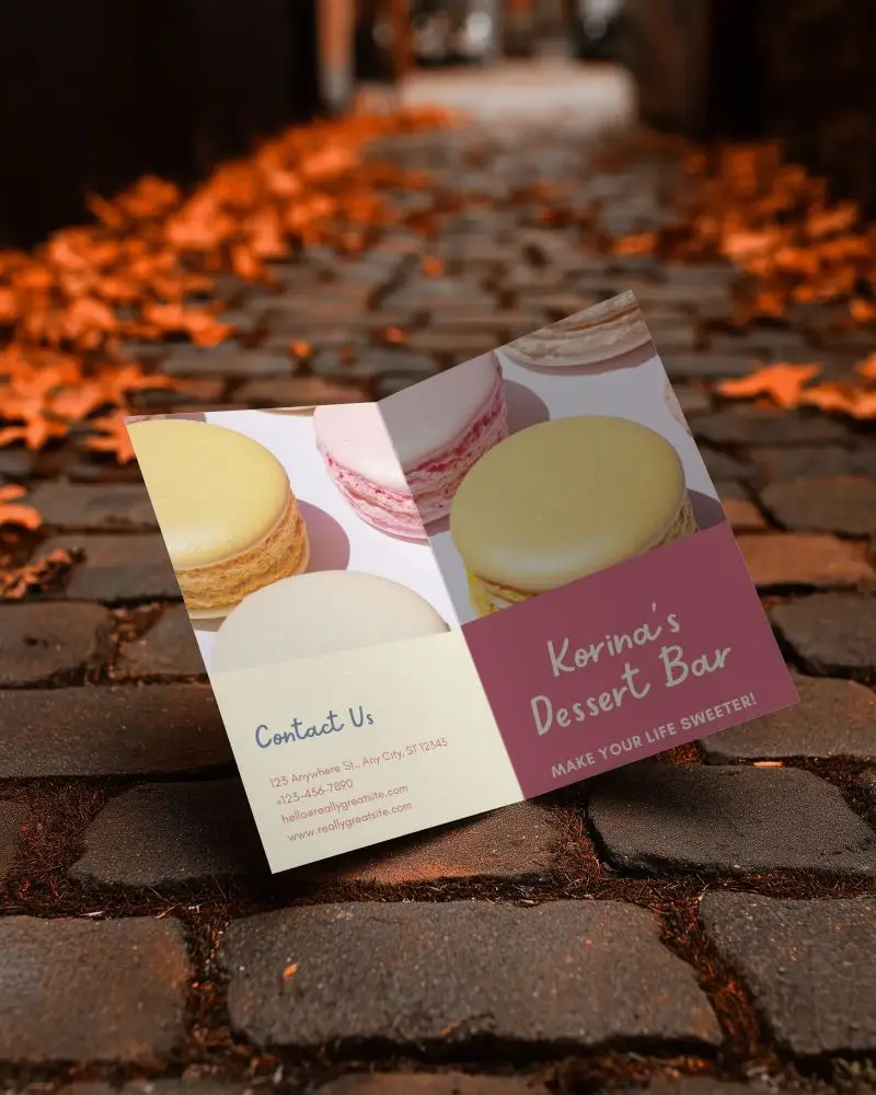 Blank Folded Brochure Mockup On Textured Stone Pavement With Scattered Leaves Background