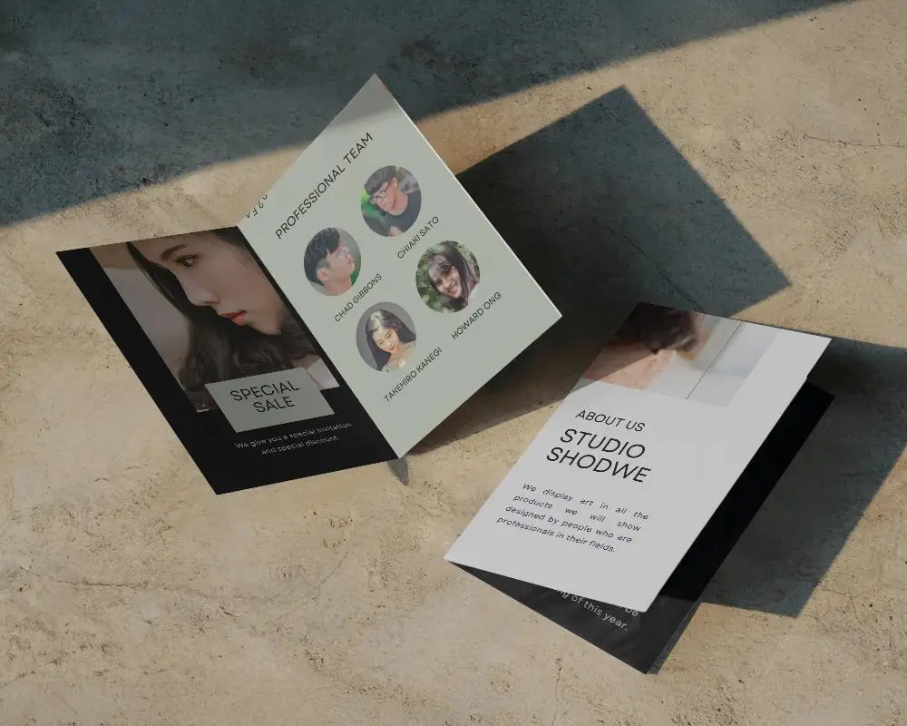Dual Bifold Brochure Mockup On Textured Ground With Angled Light And Contemporary Style