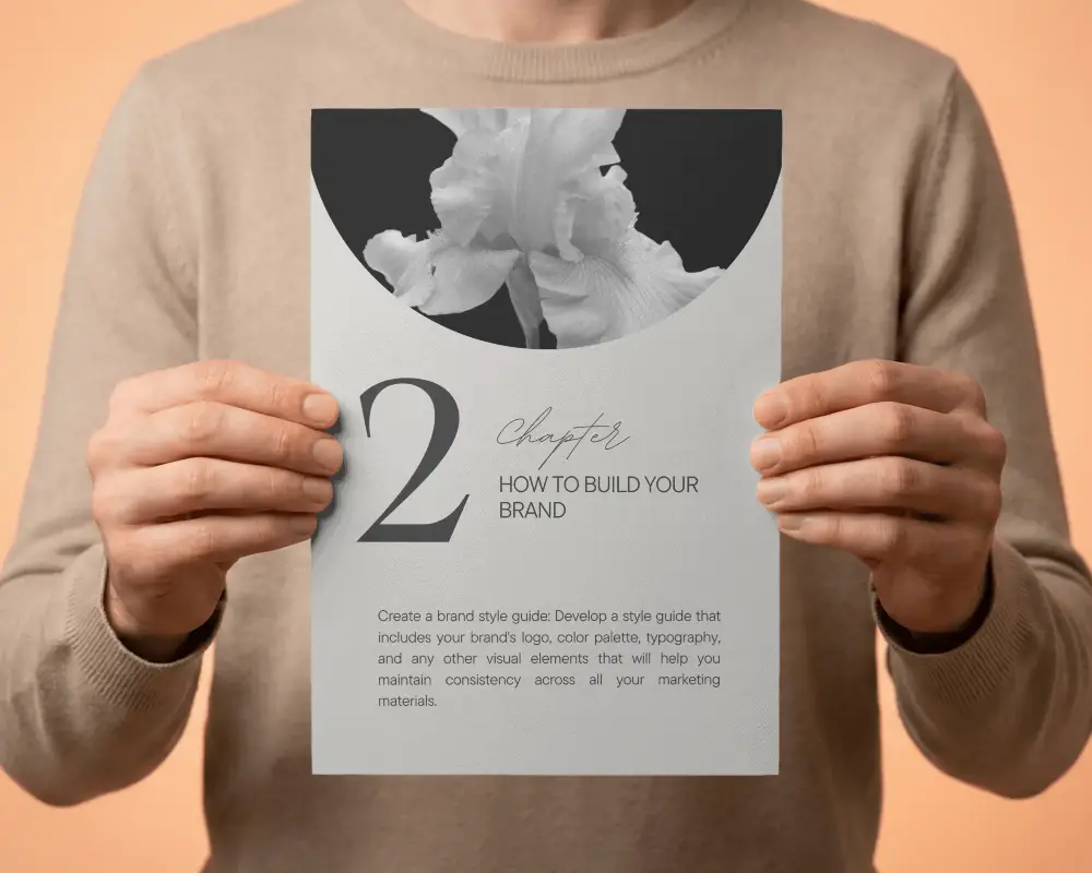 Person Holding Blank Paper Brochure Mockup Showcasing Printing Design Presentation