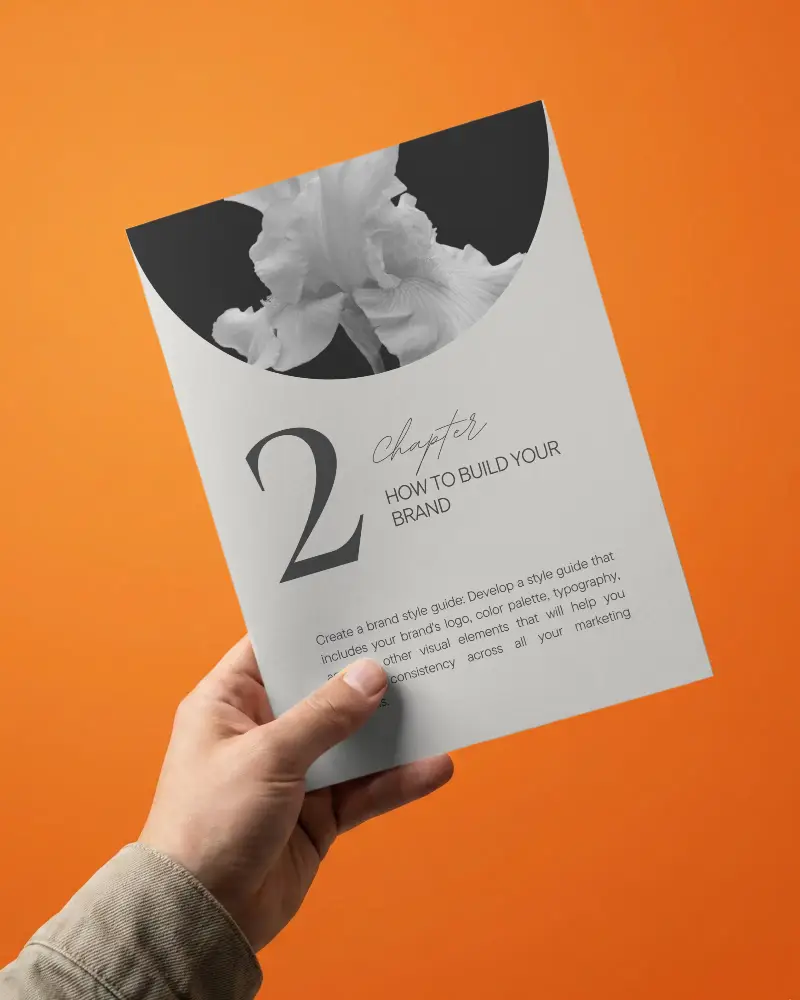 Realistic Flat Brochure Mockup In Hand Showcasing Designs On Minimalist Background