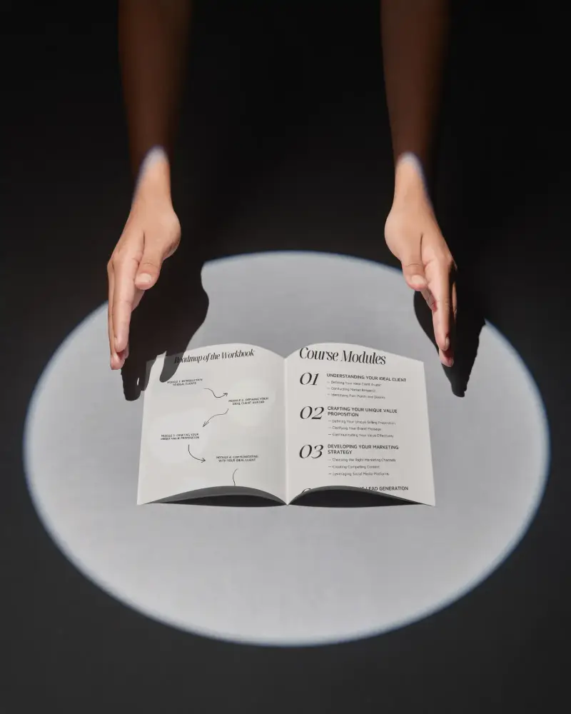 Blank Open Brochure Mockup Under Hands On Spotlight For Marketing Presentations