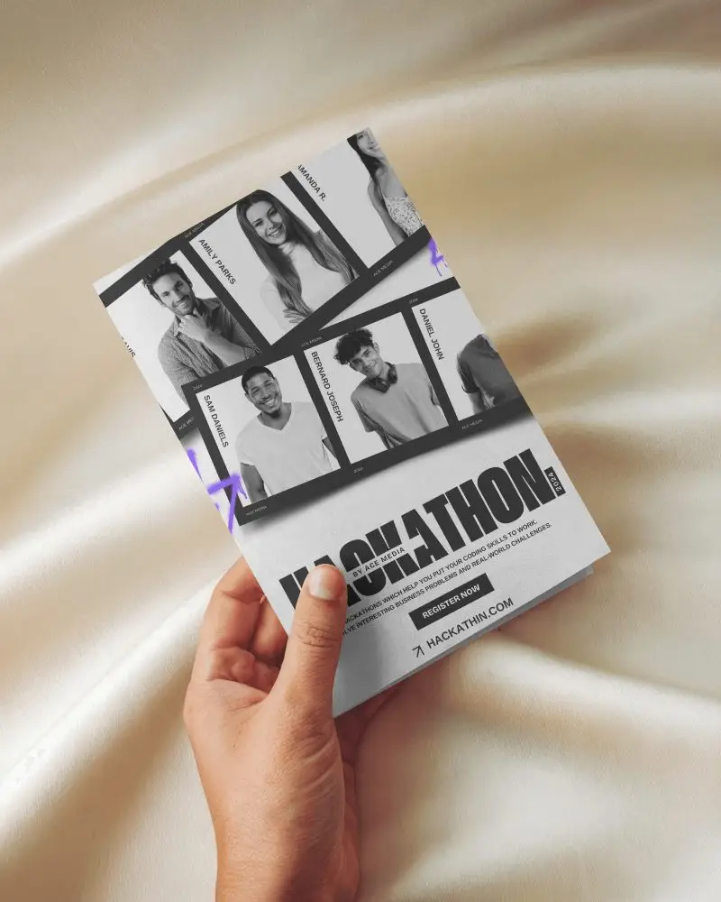 Hand Holding Brochure Mockup Over Soft Cream Satin Fabric Background Elevated Perspective With Smooth Folded Layout