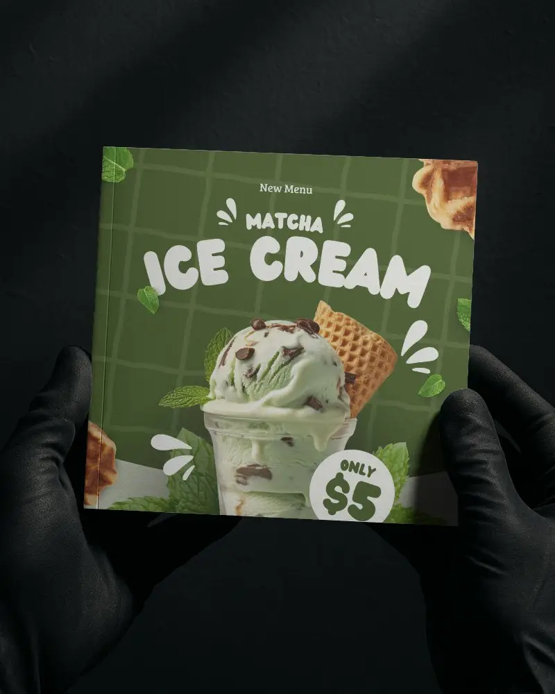 Square Brochure Mockup Held In Black Gloves Against Dark Background Featuring Promotion Vibrant And Bold Layout