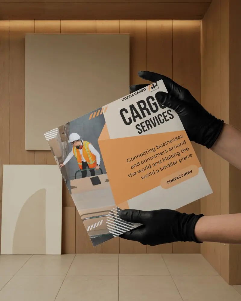 Square Brochure Mockup Held By Two Gloved Hands In Wood Paneled Room With Minimalist Wall Art And Tiled Flooring