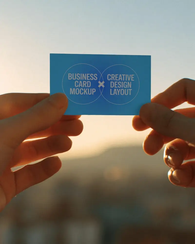 Human Hands Holding Business Card Mockup With Sunset Background For Mockup Use