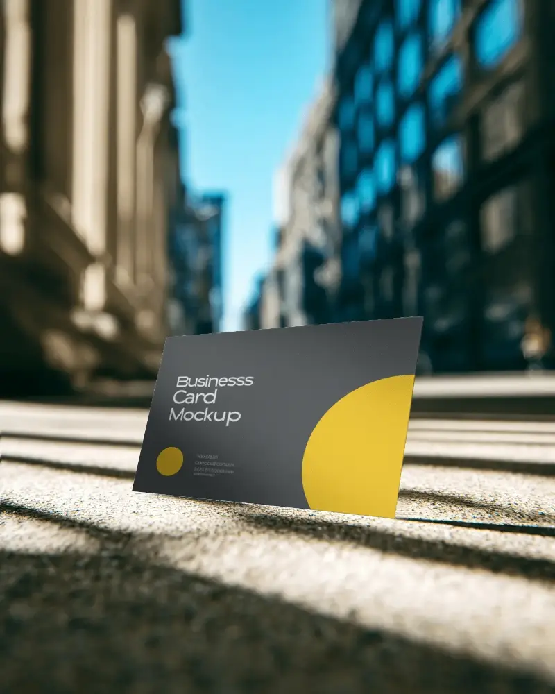 Business Card Template Mockup On Ground With Urban Building And Soft Shadows