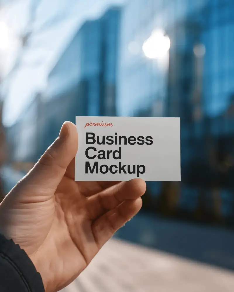 Hand Holding Business Card Mockup Outdoor Modern Cityscape Background Corporate Networking