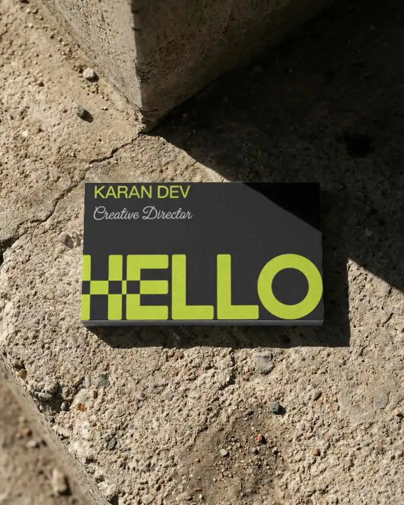 Minimalist Horizontal Business Card Mockup Placed On Rough Concrete Ground With Shadows
