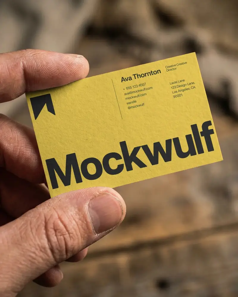 Closeup View Of Hand Holding Plain Textured Business Card Mockup For Design