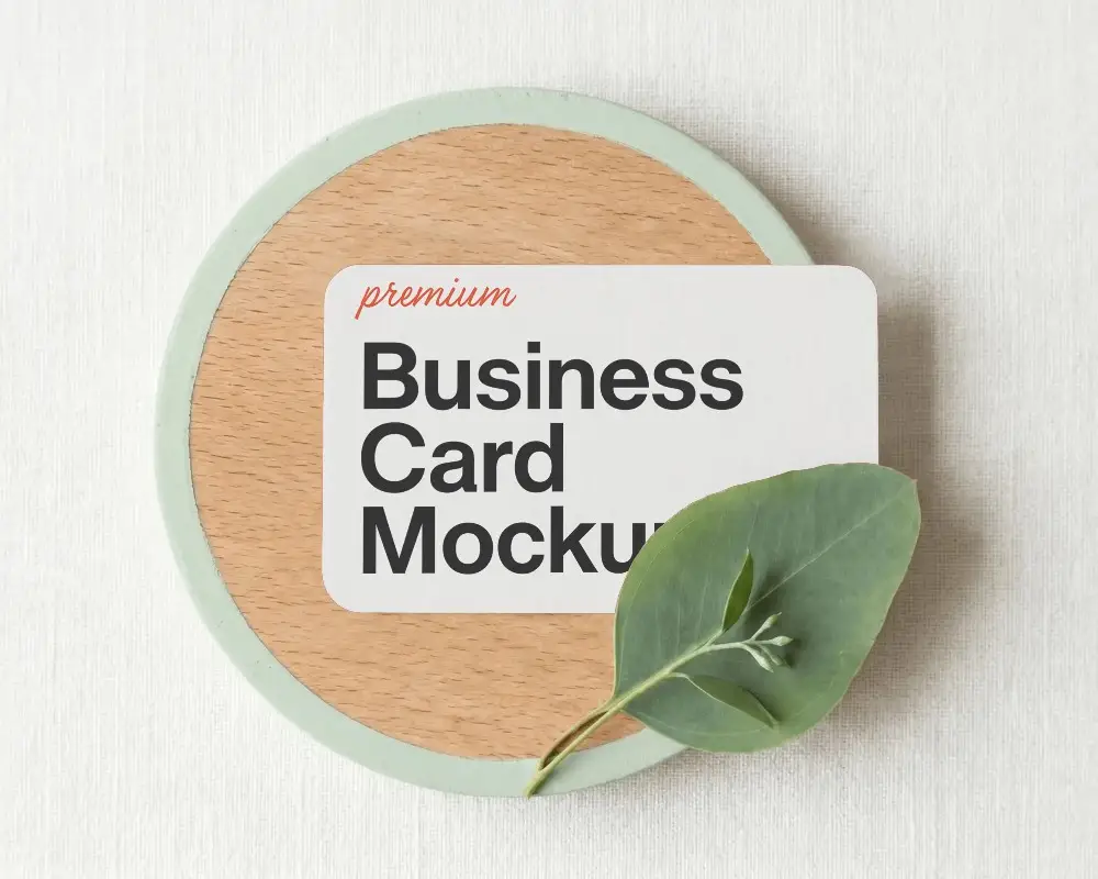 Eco Friendly Business Card Mockup With Natural Leaf On Wooden Round Plate
