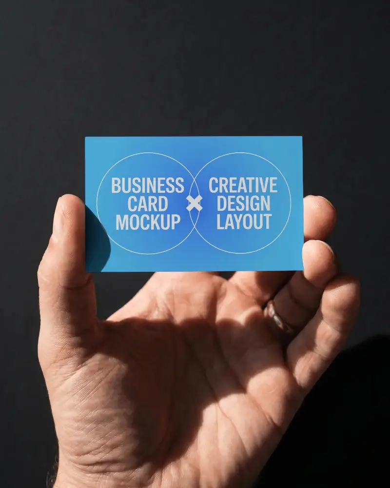Professional Hand Holding Business Card Mockup Isolated On Dark Backdrop
