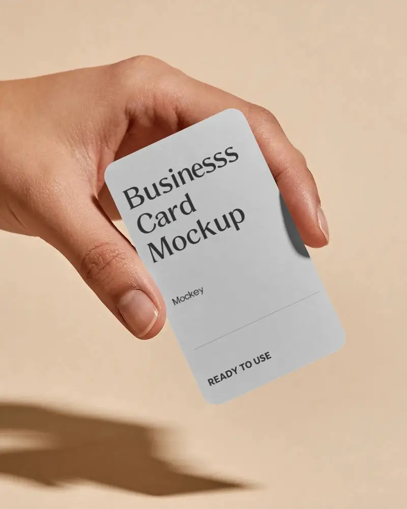 Minimalistic Business Card Mockup With Rounded Corners Held By A Realistic Hand