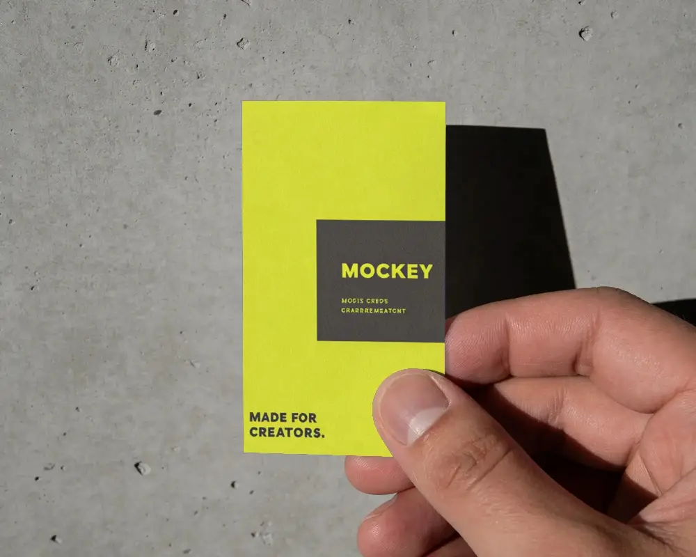 Hand Holding Business Card Mockup Over Rough Concrete Wall Background Photography