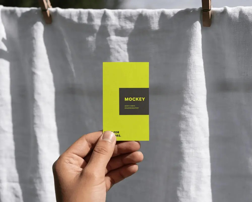 Hand Holding Business Card Mockup With Natural Light And Shadow Effects