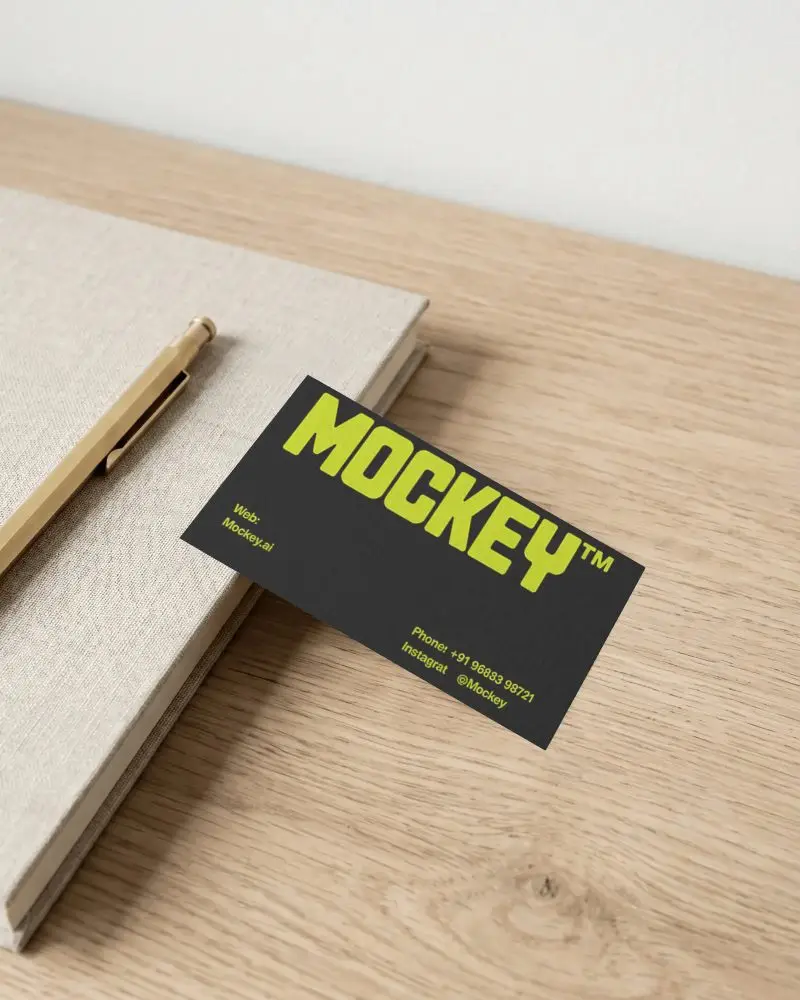 Minimalist Textured Business Card Mockup On Wooden Desk With Notebook And Pen