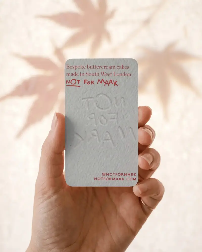 Hand Holding Textured Vertical Business Card Mockup With Rounded Corners And Soft Background
