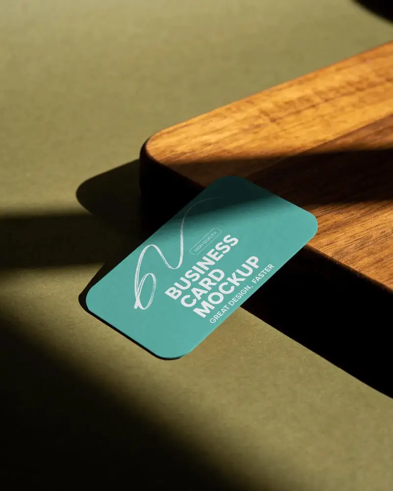 Minimalist Curved Edge Business Card On Textured Surface Showcasing Elegant Brand Identity