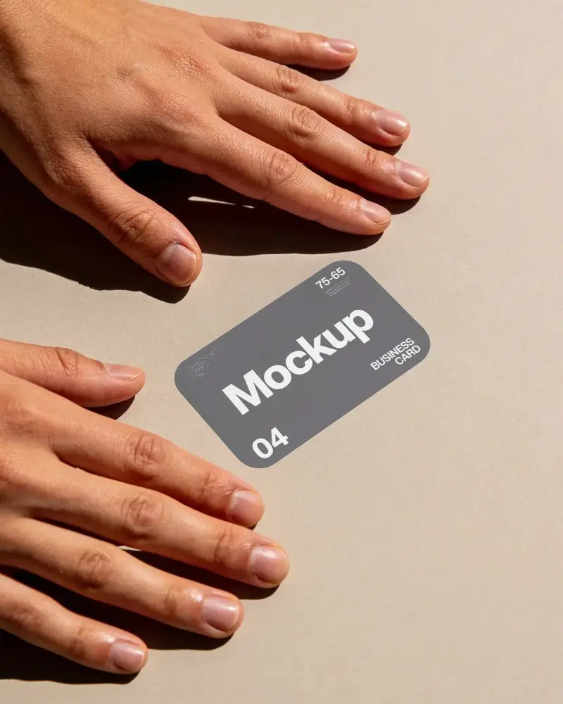 High Resolution Business Card Mockup With Naturally Lit Hands On Simple Flat Surface Scene