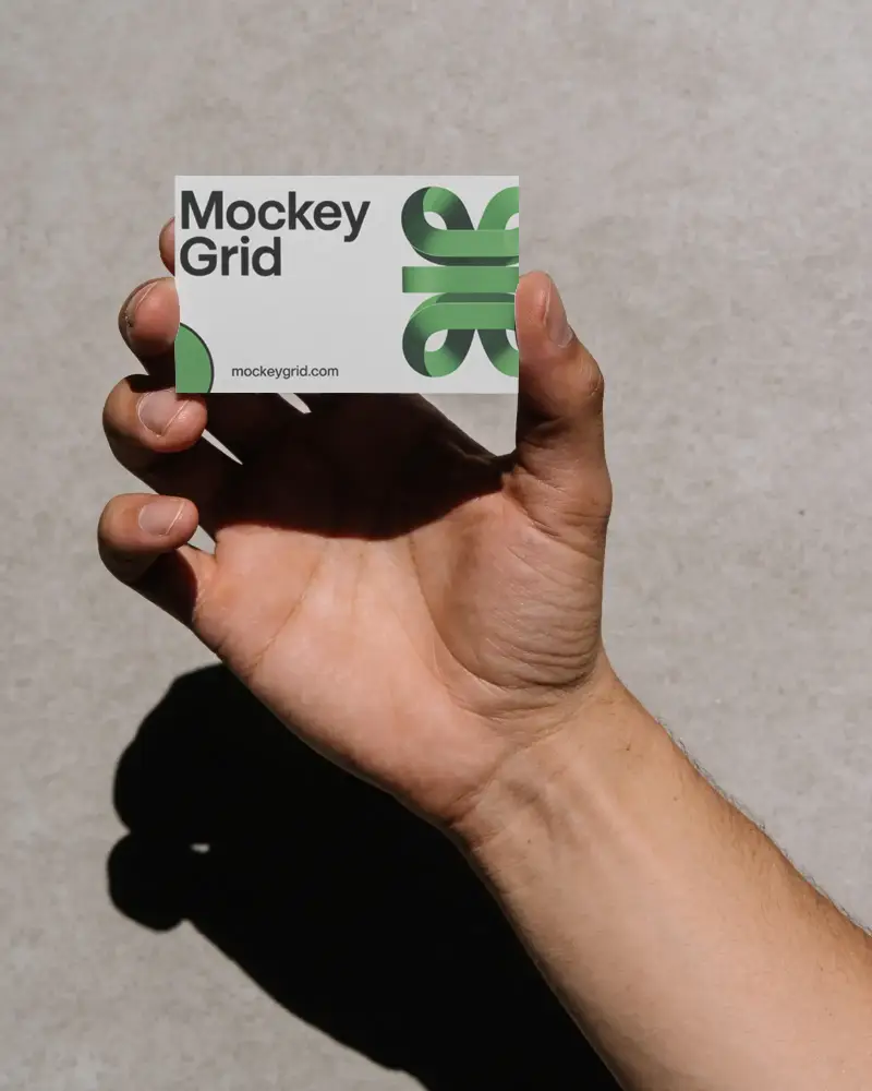 Minimalist Business Card Mockup Held By Hand On Neutral Background For Marketing Use