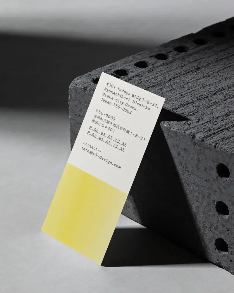 Minimalistic Vertical Business Card Mockup Standing Against Textured Surface For Branding