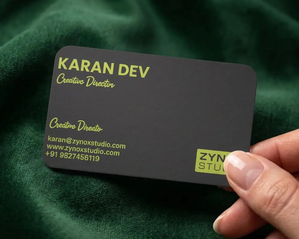 Minimalist Textured Business Card Mockup Held By Clean Fingernails On Fabric Background