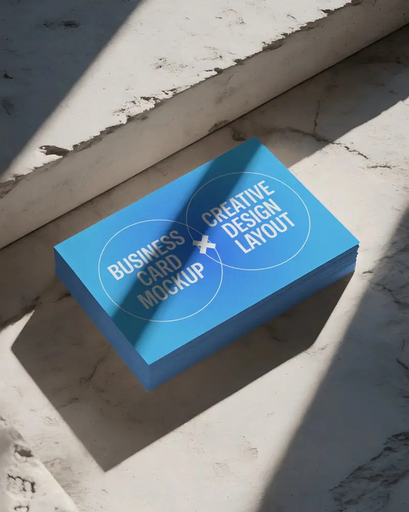 clean-elegant-business-card-mockup-with-strong-contrast-lighting-and-rough-textured-floor