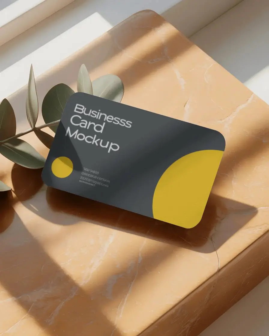 elegant-rounded-corner-business-card-mockup-on-textured-surface-with-shadow-play