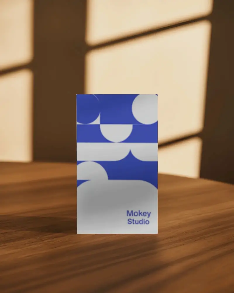 Professional Business Card Mockup Standing Upright On Wood Table With Window Shadow