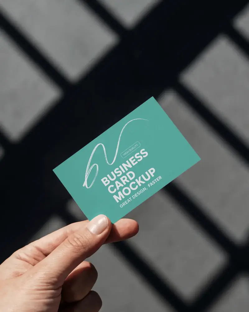 Hand Holding Business Card Mockup Against Grid Shadow Background Clean Modern Look